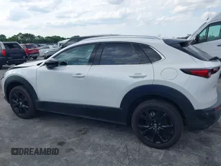 2024 Mazda CX-30 Premium z VIN 3MVDMBDY7RM706554, wystawiony jako IAAI lot #42322863 z przebiegiem 2817 mil mil oraz . Historia ofert i sprzedaży dostępna na DreamBid. Obrazek 14.