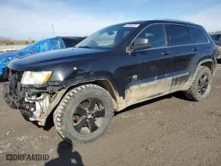 2011 Jeep Grand Cherokee Laredo with VIN 1J4RR4GG4BC624399, listed as a Copart auction lot 52796525 with 242,317 mi miles and Clean Title. Bid and sale history available at carsss.com. Image 1.