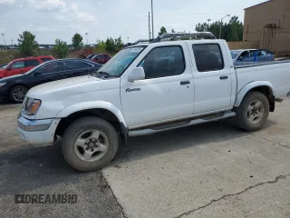 2000 Nissan Frontier XE with VIN 1N6ED27T1YC385792, listed as a Copart auction lot 62268225 with 291,906 mi miles and Salvage title. Bid and sale history available at DreamBid. Image 1.