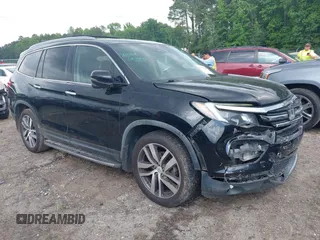 2017 Honda Pilot Touring with VIN 5FNYF5H99HB037126, listed as a IAAI auction lot 42275048 with 164,289 mi miles and . Bid and sale history available at DreamBid. Image 1.