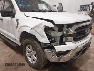 2023 Ford F-150 XL with VIN 1FTFW1ED6PFC14587, listed as a IAAI auction lot 41827273 with 87,267 mi miles. Bid and sale history available at carsss.com. Image 6.