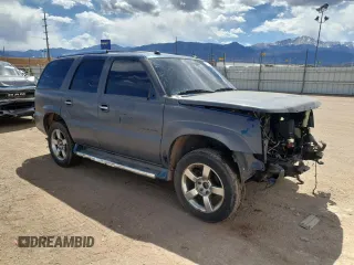 2005 Cadillac Escalade z VIN 1GYEK63N15R156958, wystawiony jako Copart lot #55286165 z przebiegiem Nie podano mil oraz Czysty tytuł • Clean title. Historia ofert i sprzedaży dostępna na DreamBid. Obrazek 4.