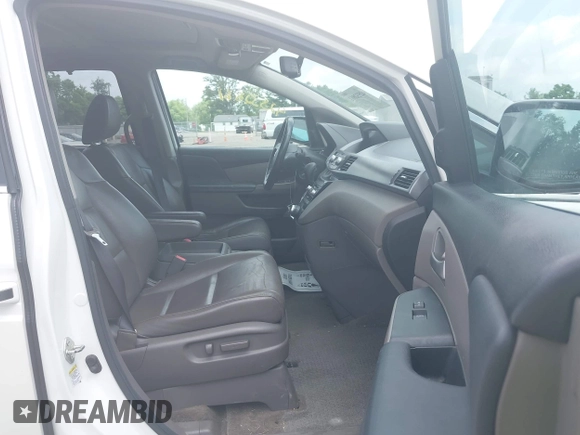 2013 Honda Odyssey Touring with VIN 5FNRL5H9XDB049390, listed as a IAAI auction lot 42532861 with 129,376 mi miles and . Bid and sale history available at DreamBid. Image 5.