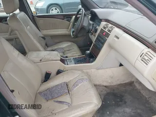 1997 Mercedes-Benz E-Class with VIN WDBJF55F3VJ034009, listed as a IAAI auction lot 41710225 with 239,673 mi miles. Bid and sale history available at carsss.com. Image 5.