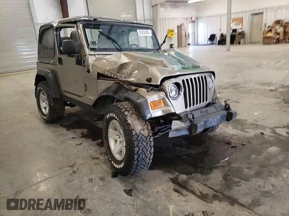 2004 Jeep Wrangler Rubicon z VIN 1J4FA69S44P784141, wystawiony jako Copart lot #55235305 z przebiegiem 125 564 mil mil oraz Szkoda całkowita • Salvage title. Historia ofert i sprzedaży dostępna na DreamBid. Obrazek 14.