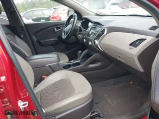 2012 Hyundai Tucson Limited with VIN KM8JU3ACXCU345113, listed as a IAAI auction lot 41946239 with 173,007 mi miles. Bid and sale history available at carsss.com. Image 5.