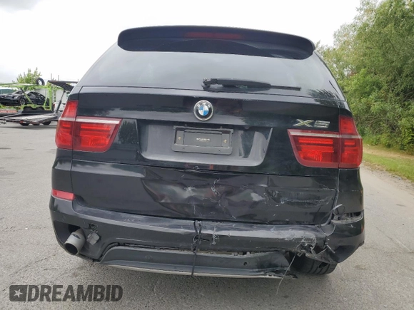 2012 BMW X5 35d with VIN 5UXZW0C54CL671377, listed as a Copart auction lot 60936395 with 105,903 mi miles and Salvage title. Bid and sale history available at DreamBid. Image 6.