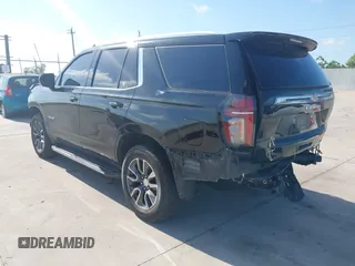 2023 Chevrolet Tahoe LT z VIN 1GNSCNKDXPR477061, wystawiony jako IAAI lot #42225743 z przebiegiem 57 077 mil mil oraz . Historia ofert i sprzedaży dostępna na DreamBid. Obrazek 3.