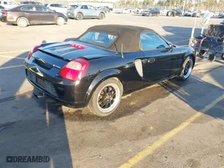 2000 Toyota MR2 Spyder with VIN JTDFR3204Y0020262, listed as a IAAI auction lot 41823386 with 203,044 mi miles. Bid and sale history available at carsss.com. Image 4.