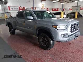 2021 Toyota Tacoma SR5 z VIN 3TMDZ5BN5MM114494, wystawiony jako IAAI lot #41723032 z przebiegiem 54 477 mil mil oraz . Historia ofert i sprzedaży dostępna na DreamBid. Obrazek 1.