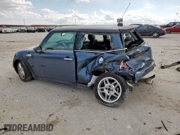 2010 MINI Hardtop S with VIN WMWMF7C51ATZ69061, listed as a Copart auction lot 60837465 with 102,506 mi miles and Salvage title. Bid and sale history available at DreamBid. Image 2.