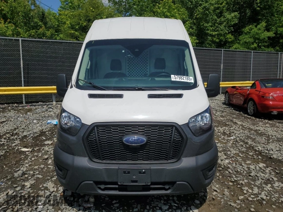 2021 Ford Transit Cargo с VIN 1FTBR1X80MKA26754, выставлен на аукционе Copart как лот 57982185 с пробегом 80 537 миль миль и Списание • Salvage title. История ставок и продаж доступна на DreamBid. Изображение 5.