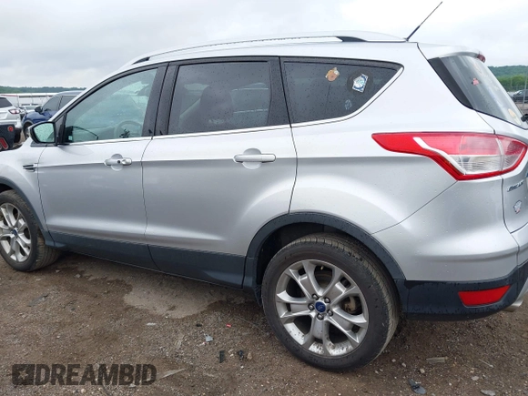 2015 Ford Escape Titanium with VIN 1FMCU0JX7FUB60418, listed as a IAAI auction lot 42485107 with 82,172 mi miles and . Bid and sale history available at DreamBid. Image 14.
