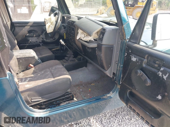 1998 Jeep Wrangler Sport with VIN 1J4FY19S2WP786844, listed as a IAAI auction lot 42382789 with 306,228 mi miles and . Bid and sale history available at DreamBid. Image 5.