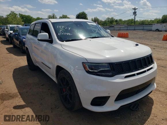 2018 Jeep Grand Cherokee with VIN NJ1449E, listed as a Copart auction lot 51357834 with 32,619 mi miles and Salvage title. Bid and sale history available at DreamBid. Image 4.