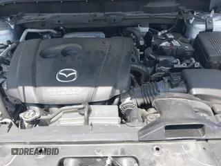 2017 Mazda CX-5 Sport with VIN JM3KFABLXH0135560, listed as a IAAI auction lot 42062016 with 153,416 mi miles. Bid and sale history available at carsss.com. Image 10.
