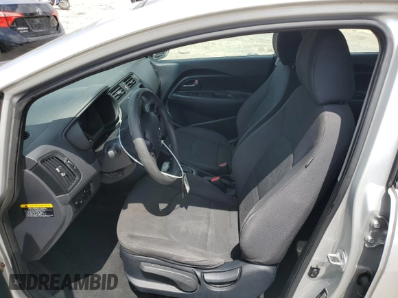 2014 Kia Rio LX with VIN KNADM4A38E6384696, listed as a Copart auction lot 58718174 with 121,760 mi miles and Salvage Title. Bid and sale history available at DreamBid. Image 7.