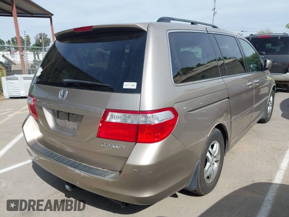 2005 Honda Odyssey EX-L z VIN 5FNRL38615B407908, wystawiony jako IAAI lot #42076045 z przebiegiem 170 950 mil mil oraz . Historia ofert i sprzedaży dostępna na DreamBid. Obrazek 4.