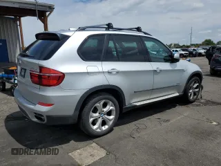 2013 BMW X5 xDrive50i with VIN 5UXZV8C58D0C14983, listed as a Copart auction lot 58820795 with 99,337 mi miles and Salvage title. Bid and sale history available at DreamBid. Image 3.