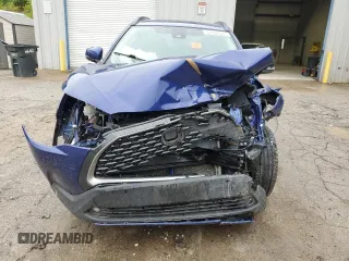 2022 Toyota Corolla Cross XLE with VIN 7MUDAABGXNV042443, listed as a Copart auction lot 57808565 with 102,887 mi miles and Salvage title. Bid and sale history available at DreamBid. Image 5.