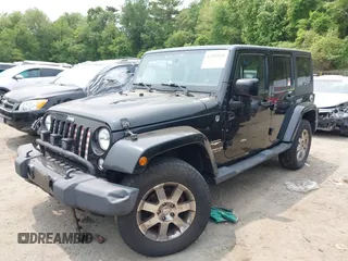2015 Jeep Wrangler Unlimited Sahara with VIN 1C4HJWEG3FL661568, listed as a IAAI auction lot 42387810 with 140,927 mi miles and . Bid and sale history available at DreamBid. Image 2.