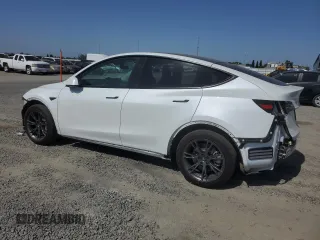 2024 Tesla Model Y Long Range with VIN 7SAYGAEE2RF103110, listed as a Copart auction lot 59422975 with 13,572 mi miles and Salvage title. Bid and sale history available at DreamBid. Image 2.
