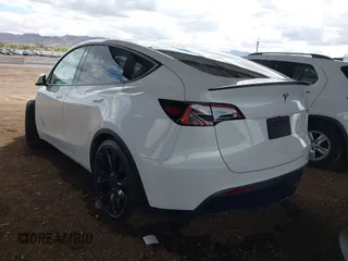 2022 Tesla Model Y Performance with VIN 7SAYGDEF4NF449986, listed as a IAAI auction lot 41754916 with 64,384 mi miles and . Bid and sale history available at DreamBid. Image 3.