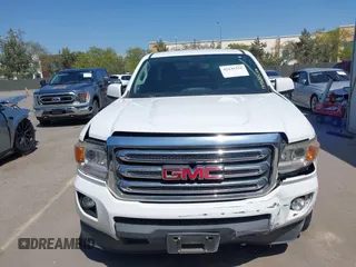 2015 GMC Canyon 2WD SLE z VIN 1GTH5BEA4F1239815, wystawiony jako IAAI lot #42135355 z przebiegiem 110 696 mil mil oraz . Historia ofert i sprzedaży dostępna na DreamBid. Obrazek 13.