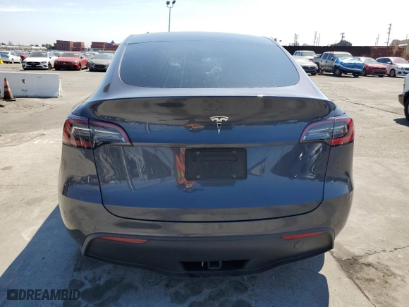 2022 Tesla Model Y Long Range with VIN 7SAYGAEE1NF486077, listed as a Copart auction lot 50526795 with 24,858 mi miles and Salvage Title. Bid and sale history available at carsss.com. Image 6.