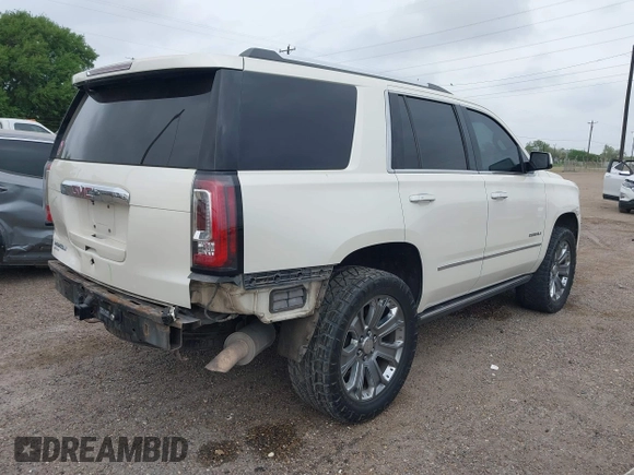 2015 GMC Yukon Denali z VIN 1GKS1CKJ3FR713531, wystawiony jako IAAI lot #41866691 z przebiegiem 157 666 mil mil oraz . Historia ofert i sprzedaży dostępna na DreamBid. Obrazek 4.