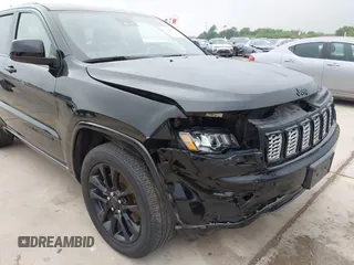 2021 Jeep Grand Cherokee Laredo X with VIN 1C4RJEAG8MC714539, listed as a IAAI auction lot 42190686 with 59,359 mi miles and . Bid and sale history available at DreamBid. Image 6.