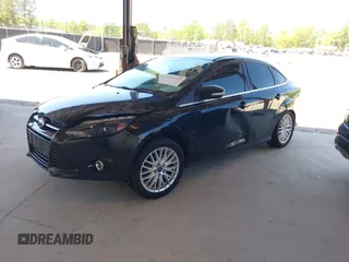 2013 Ford Focus Titanium with VIN 1FADP3J20DL143491, listed as a IAAI auction lot 42034388 with 194,388 mi miles and . Bid and sale history available at carsss.com. Image 2.