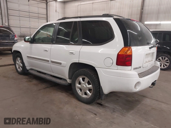 2003 GMC Envoy SLT with VIN 1GKDT13S332222847, listed as a IAAI auction lot 41771052 with 203,699 mi miles. Bid and sale history available at carsss.com. Image 3.