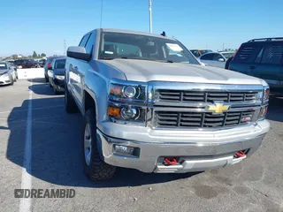 2015 Chevrolet Silverado 1500 LT with VIN 3GCUKRECXFG328033, listed as a IAAI auction lot 41659585 with 185,417 mi miles. Bid and sale history available at carsss.com. Image 1.