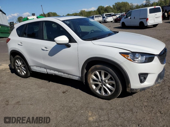 2014 Mazda CX-5 Grand Touring with VIN JM3KE4DY2E0354795, listed as a Copart auction lot 54205775 with 62,939 mi miles and Salvage Title. Bid and sale history available at DreamBid. Image 4.