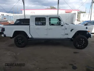 2023 Jeep Gladiator Overland with VIN 1C6HJTFG7PL543870, listed as a IAAI auction lot 42056969 with 28,655 mi miles and . Bid and sale history available at DreamBid. Image 14.