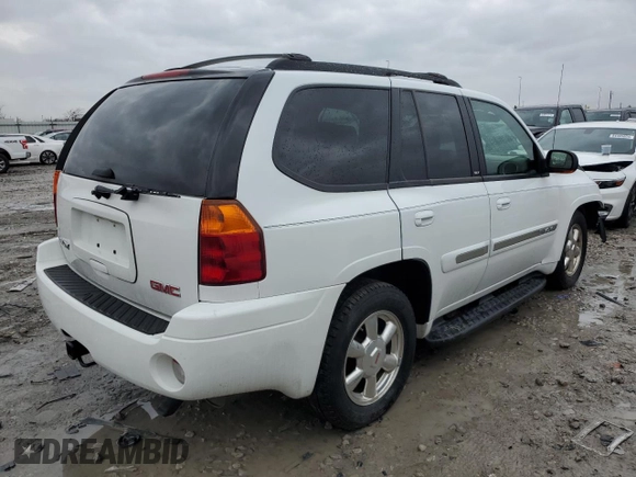 2004 GMC Envoy SLT with VIN 1GKDT13SX42404837, listed as a Copart auction lot 84515994 with 184,153 mi miles and Salvage Title. Bid and sale history available at carsss.com. Image 3.