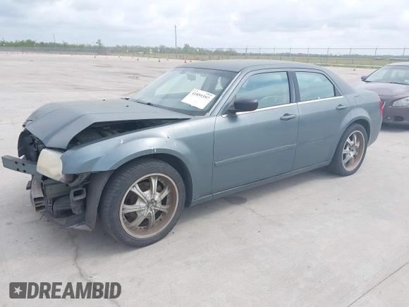 2006 Chrysler 300 with VIN 2C3KA43R56H217771, listed as a IAAI auction lot 41859397 with 154,227 mi miles. Bid and sale history available at carsss.com. Image 2.