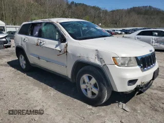 2011 Jeep Grand Cherokee Laredo with VIN 1J4RR4GG8BC724196, listed as a Copart auction lot 51760195 with 79,407 mi miles and Salvage Title. Bid and sale history available at DreamBid. Image 4.