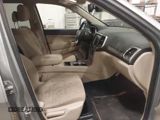 2015 Jeep Grand Cherokee Laredo with VIN 1C4RJFAG4FC797069, listed as a IAAI auction lot 41435299 with 146,755 mi miles. Bid and sale history available at carsss.com. Image 5.