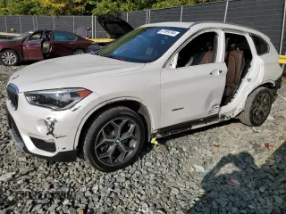 2017 BMW X1 xDrive28i with VIN WBXHT3C33H5F70208, listed as a Copart auction lot 67999764 with 130,341 mi miles and Salvage Title. Bid and sale history available at carsss.com. Image 1.