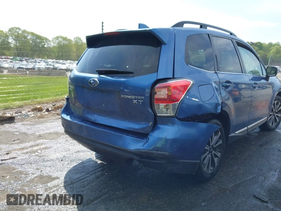 2017 Subaru Forester Touring with VIN JF2SJGWC5HH567870, listed as a IAAI auction lot 42007542 with 76,560 mi miles. Bid and sale history available at carsss.com. Image 6.