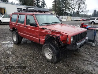 1999 Jeep Cherokee SE with VIN 1J4FF28S9XL645291, listed as a Copart auction lot 87064124 with Not provided miles and Salvage title. Bid and sale history available at DreamBid. Image 4.