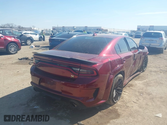 2022 Dodge Charger Scat Pack with VIN 2C3CDXGJ6NH216788, listed as a IAAI auction lot 41670744 with 48,680 mi miles and . Bid and sale history available at carsss.com. Image 4.