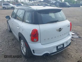 2015 MINI Countryman S with VIN WMWZC5C59FWM18935, listed as a IAAI auction lot 42427878 with 121,410 mi miles and . Bid and sale history available at DreamBid. Image 3.