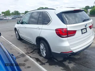 2014 BMW X5 sDrive35i z VIN 5UXKR2C54E0H34800, wystawiony jako IAAI lot #42110978 z przebiegiem 106 891 mil mil oraz . Historia ofert i sprzedaży dostępna na DreamBid. Obrazek 3.