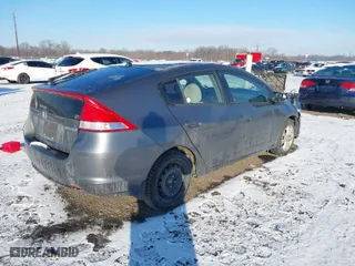 2011 Honda Insight EX with VIN JHMZE2H76BS004162, listed as a IAAI auction lot 41333373 with 287,593 mi miles. Bid and sale history available at carsss.com. Image 4.