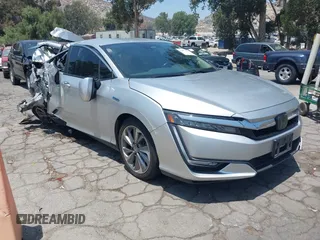 2018 Honda Clarity Touring z VIN JHMZC5F31JC021516, wystawiony jako IAAI lot #42478787 z przebiegiem 87 519 mil mil oraz . Historia ofert i sprzedaży dostępna na DreamBid. Obrazek 1.