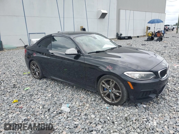 2015 BMW 2 Series M235i with VIN WBA1J7C55FV289435, listed as a Copart auction lot 59089955 with 122,328 mi miles and Salvage title. Bid and sale history available at DreamBid. Image 4.