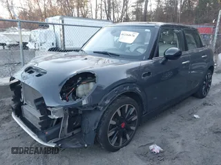 2016 MINI Cooper Hardtop 4 Door S with VIN WMWXU3C56G2B63682, listed as a IAAI auction lot 41244676 with 110,902 mi miles. Bid and sale history available at carsss.com. Image 2.